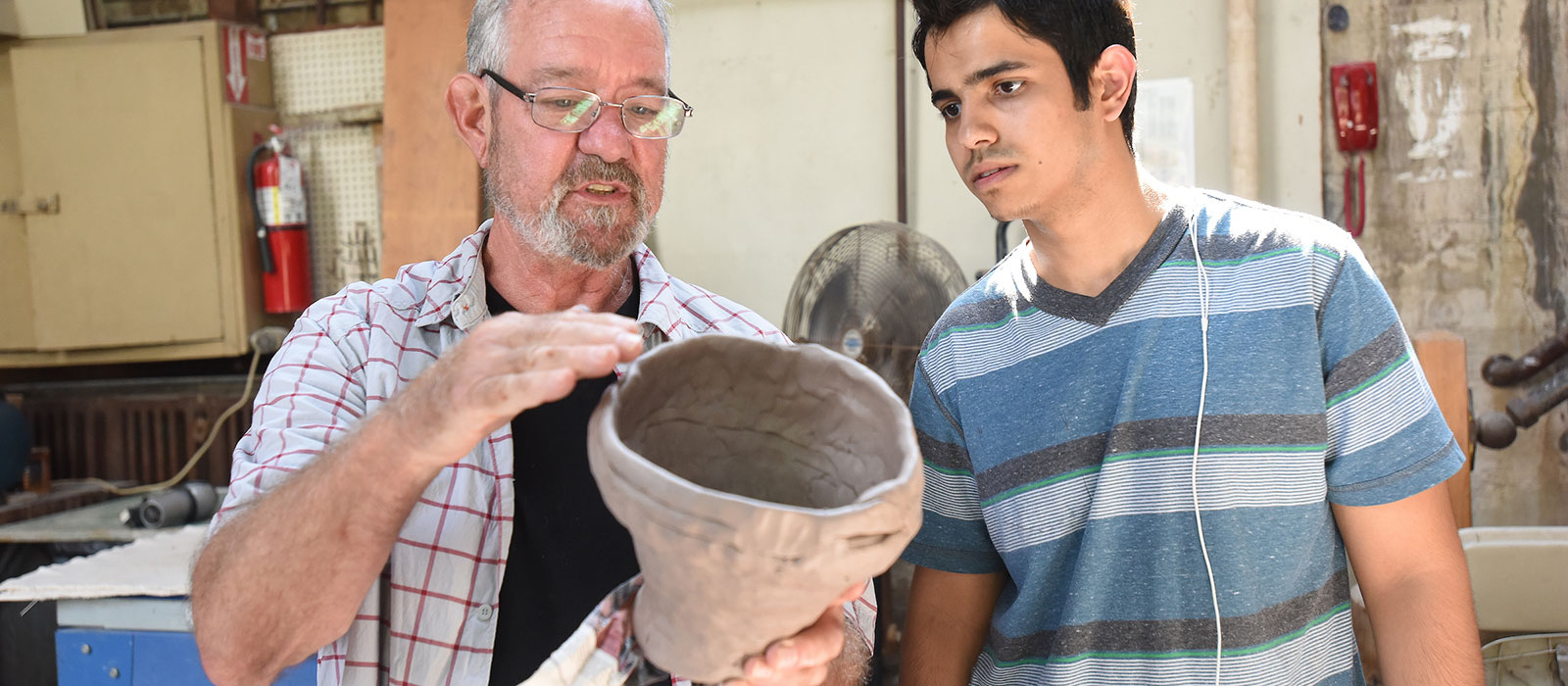 Ceramics teacher and student