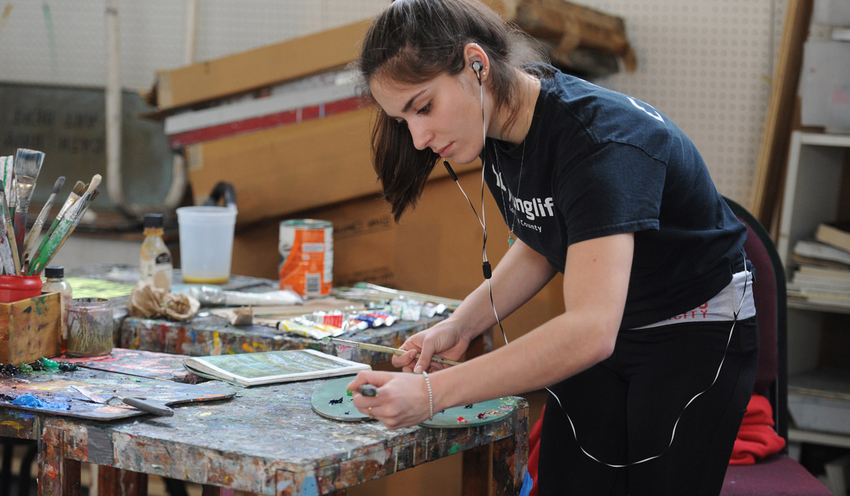 Student working in painting studio